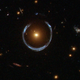 Illustration for article titled Gravitational lensing twists distant galaxy into an Einstein Ring